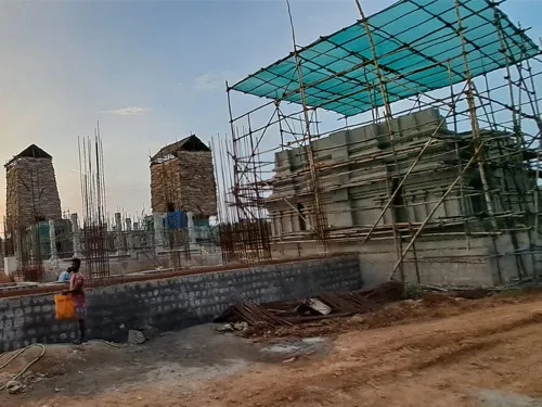 New Hindu temple construction with traditional South Indian architectural elements